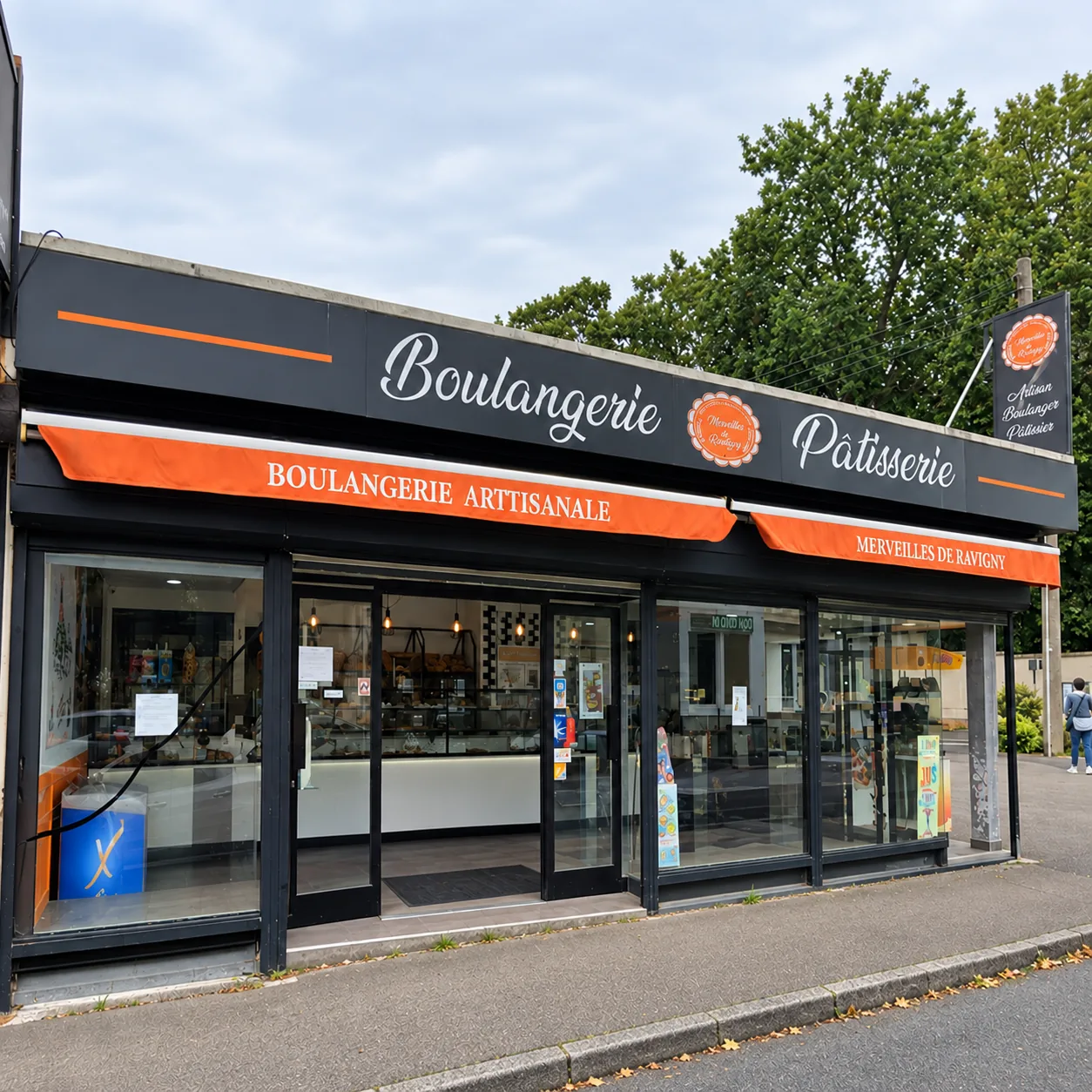 Devanture noire et stores orange de la boulangerie-pâtisserie, avenue de Rantigny